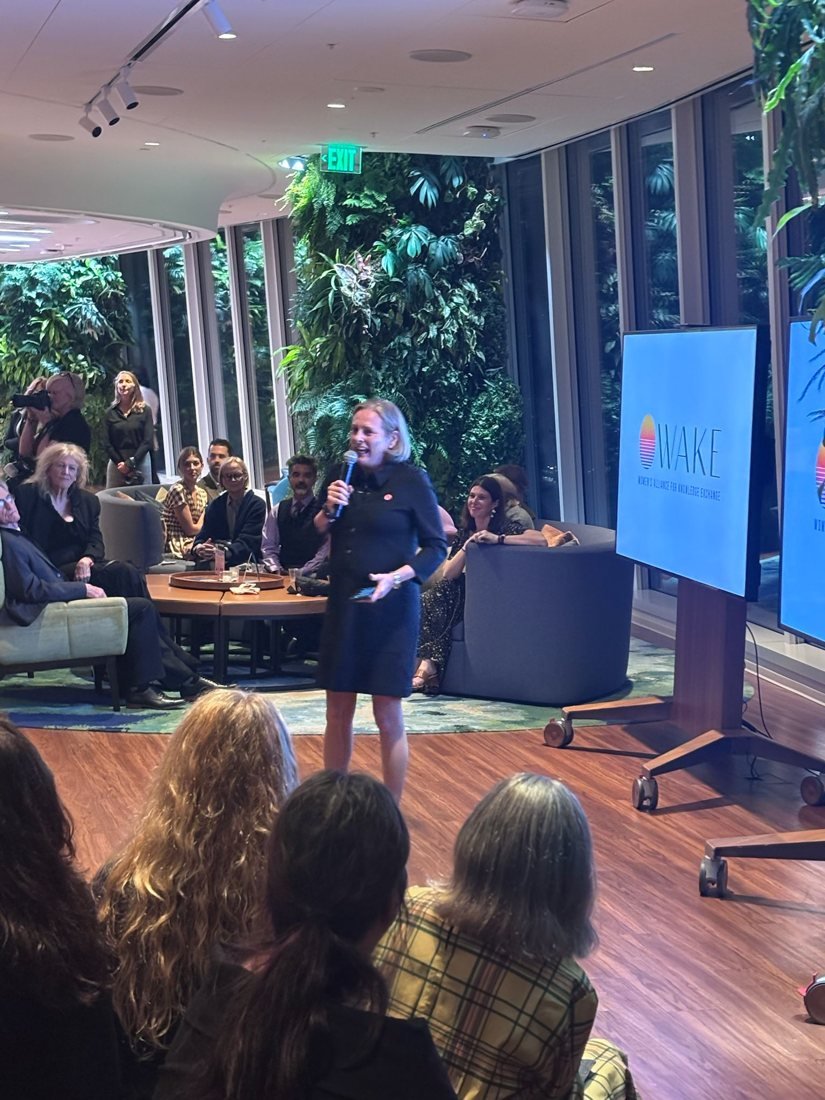 Kelly Thompson speaking at a WAKE International event